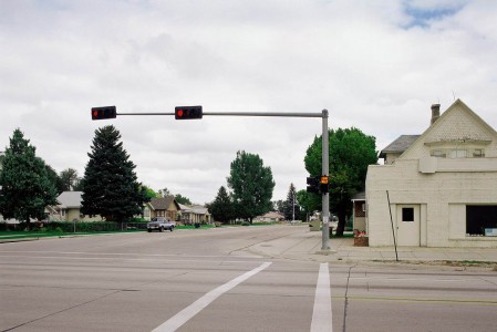 Traffic lights at intersection in suburban setting --- Image by � Royalty-Free/Corbis