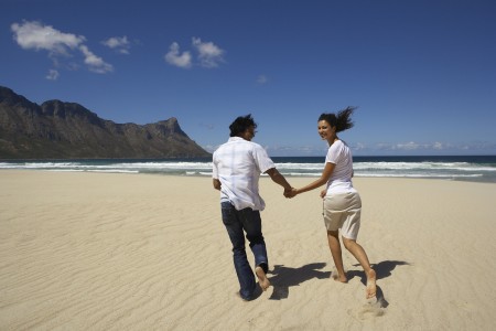 Couple Running on a Beach